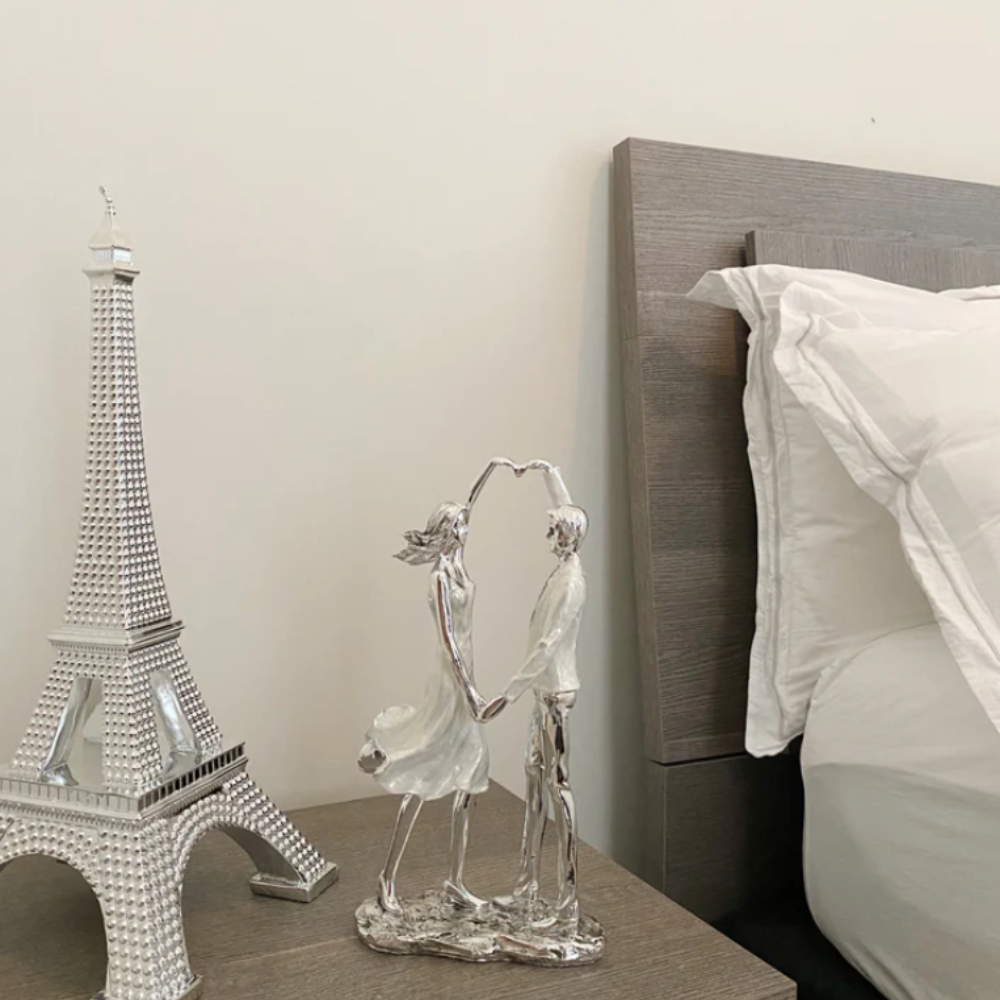 BECKETT Couple Forming a Heart Sculpture