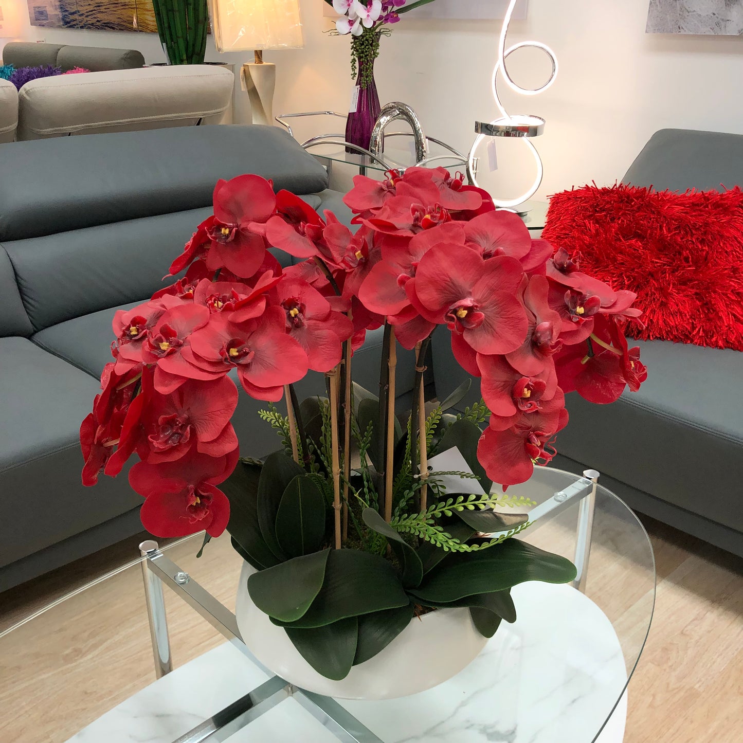 Red Orchid Arrangement With White Vase
